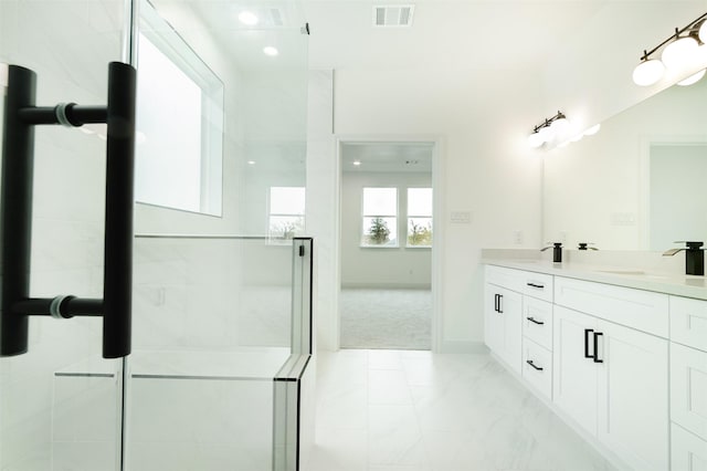 full bath with baseboards, visible vents, double vanity, a sink, and a shower stall