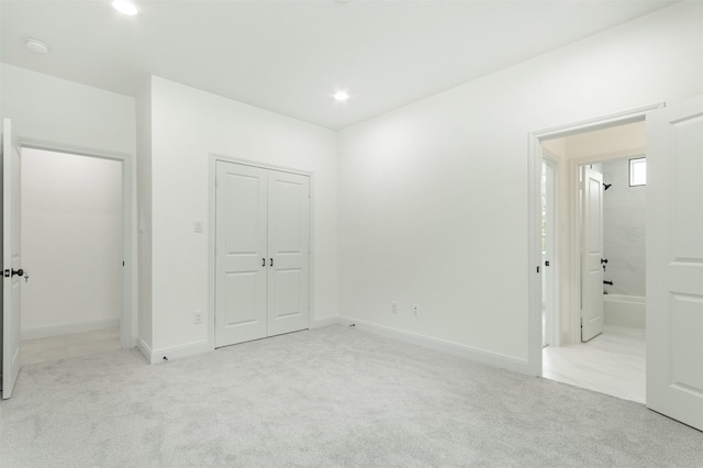 unfurnished bedroom featuring recessed lighting, light colored carpet, and baseboards