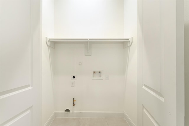 clothes washing area featuring electric dryer hookup, tile patterned floors, hookup for a gas dryer, hookup for a washing machine, and laundry area