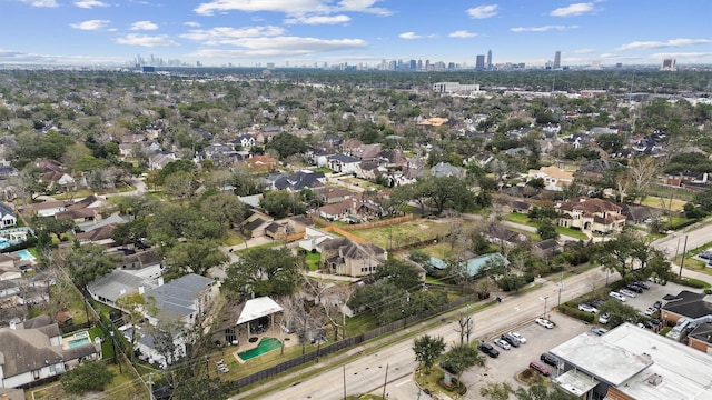 birds eye view of property featuring a city view