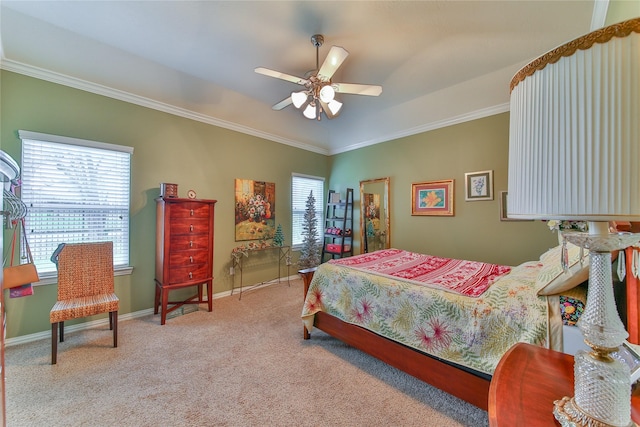 bedroom featuring ornamental molding, light colored carpet, ceiling fan, and baseboards