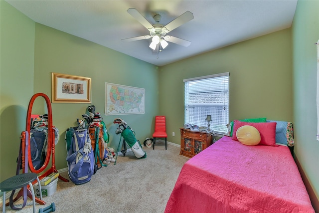 carpeted bedroom with baseboards and a ceiling fan