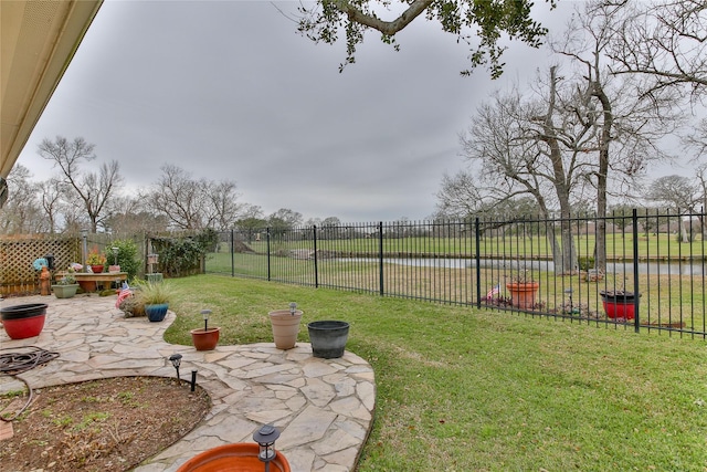 view of yard featuring a patio area and a fenced backyard