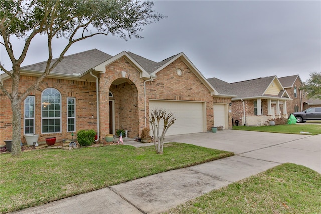 ranch-style house with a garage, driveway, a front lawn, and brick siding