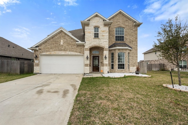 view of front of house with a front lawn, an attached garage, fence, and brick siding