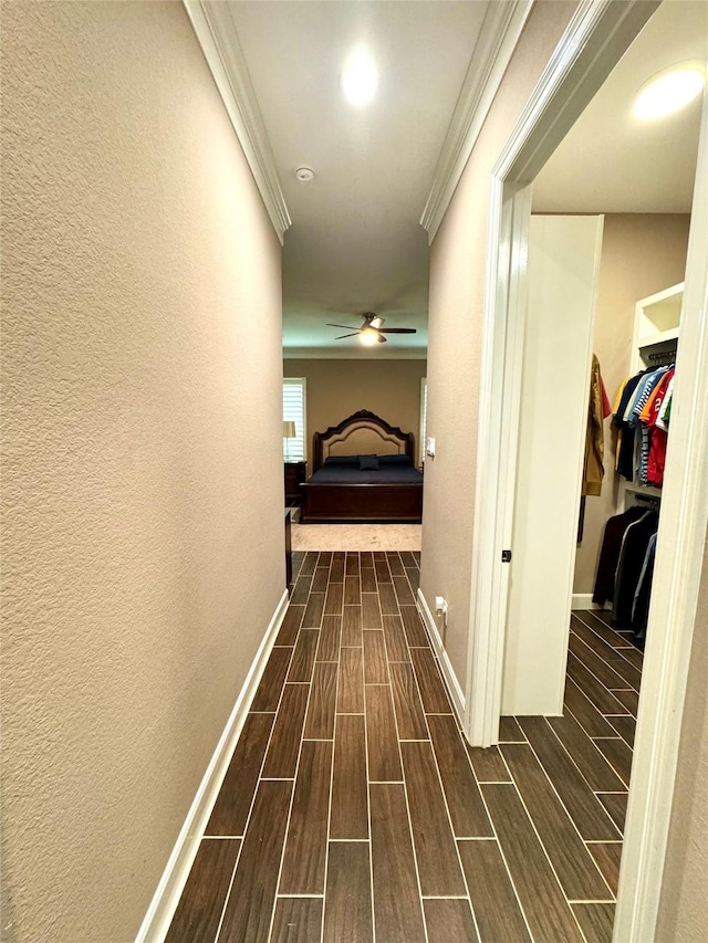 18315 Wisp Willow Way, Porter, TX 77365 - hallway with crown molding, baseboards, and wood tiled floor