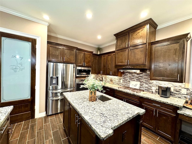 18315 Wisp Willow Way, Porter, TX 77365 - kitchen with stainless steel appliances, wood tiled floor, an island with sink, and decorative backsplash