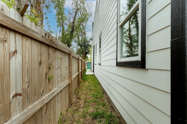 view of side of property with fence