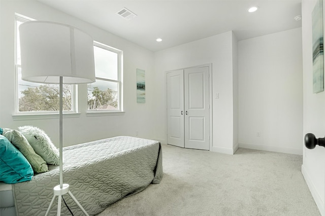 bedroom featuring baseboards, recessed lighting, visible vents, and light colored carpet