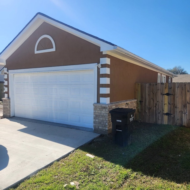 garage featuring fence