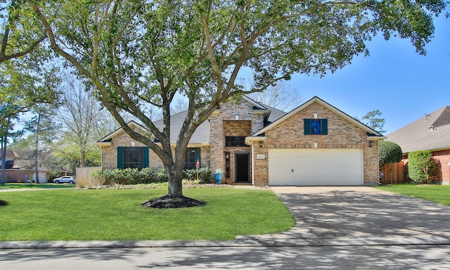 traditional-style house with an attached garage, brick siding, fence, concrete driveway, and a front yard