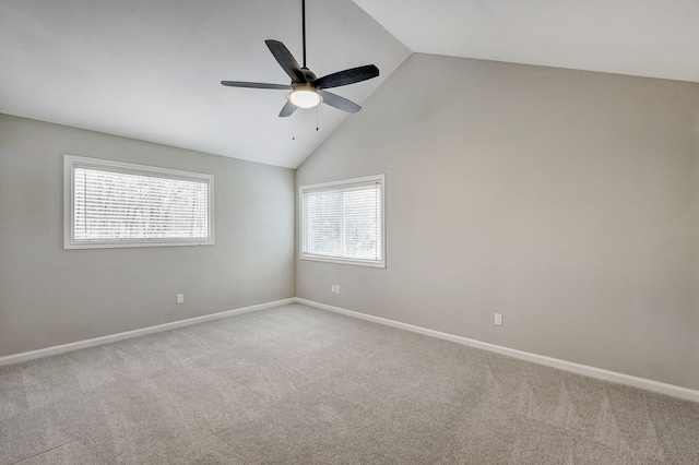 unfurnished room with baseboards, high vaulted ceiling, ceiling fan, and carpet flooring