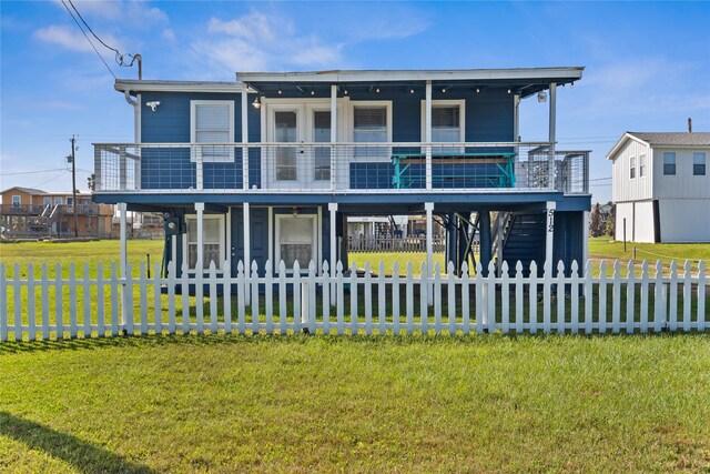 view of front of house featuring a front lawn and a fenced front yard