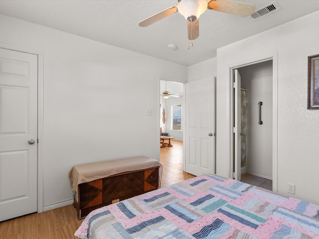 1206 Middle Dr W, Surfside Beach, TX 77541 - bedroom featuring light wood-type flooring and ceiling fan