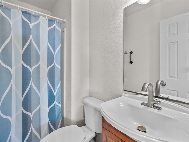 1206 Middle Dr W, Surfside Beach, TX 77541 - full bathroom with vanity, a shower with curtain, and a textured wall