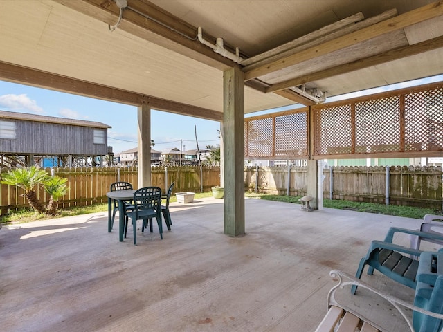 1206 Middle Dr W, Surfside Beach, TX 77541 - fenced backyard with outdoor dining space and a patio area
