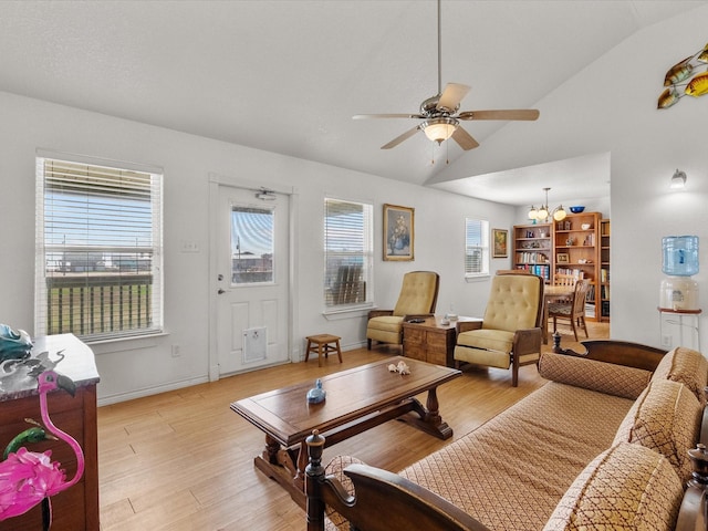 1206 Middle Dr W, Surfside Beach, TX 77541 - living room with lofted ceiling, ceiling fan, light wood finished floors, and a chandelier