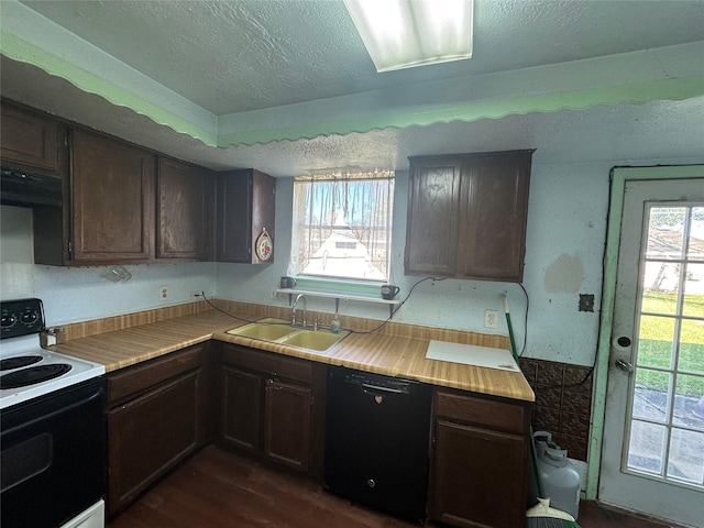 kitchen featuring light countertops, electric range, a sink, a textured ceiling, and dishwasher