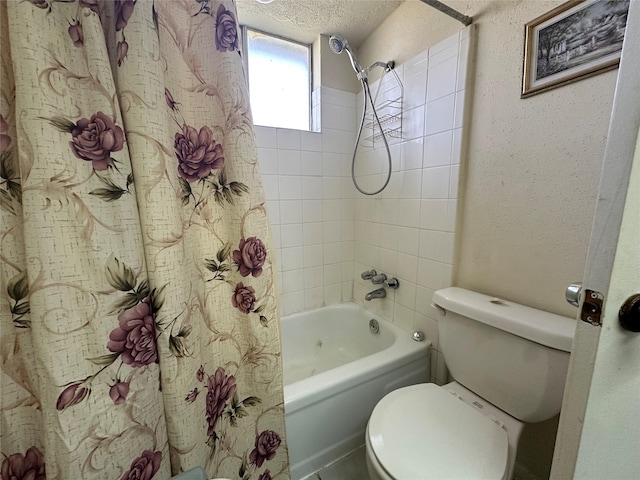 bathroom featuring a textured ceiling, a textured wall, shower / bath combination with curtain, and toilet