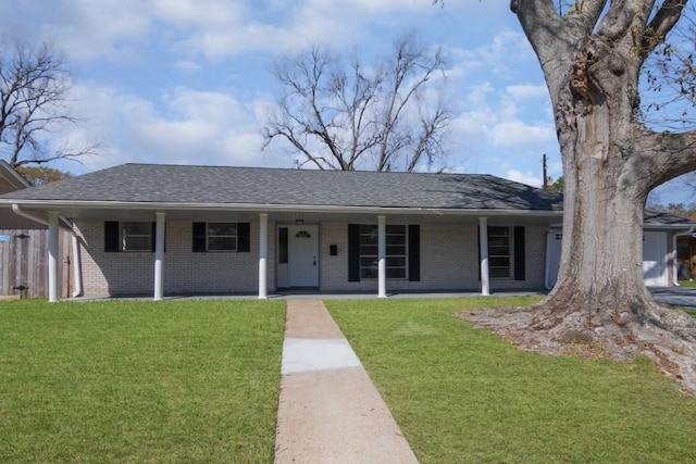 ranch-style home with brick siding, a shingled roof, fence, a porch, and a front yard