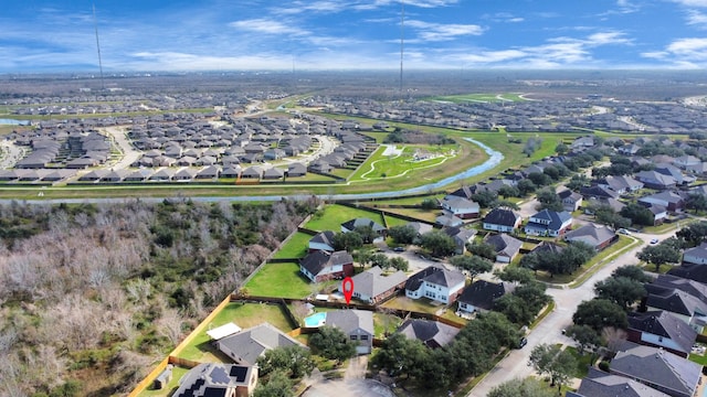 birds eye view of property with a residential view