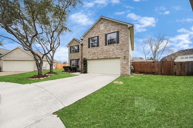 traditional-style home with concrete driveway, brick siding, a front yard, and fence