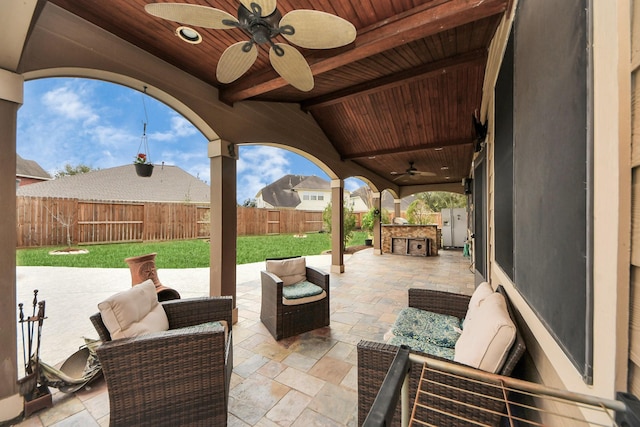 view of patio / terrace featuring ceiling fan, an outdoor living space, and a fenced backyard