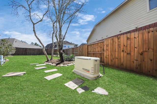 view of yard with a fenced backyard