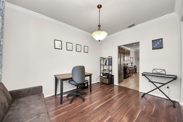 home office with dark wood-style floors, ornamental molding, visible vents, and baseboards