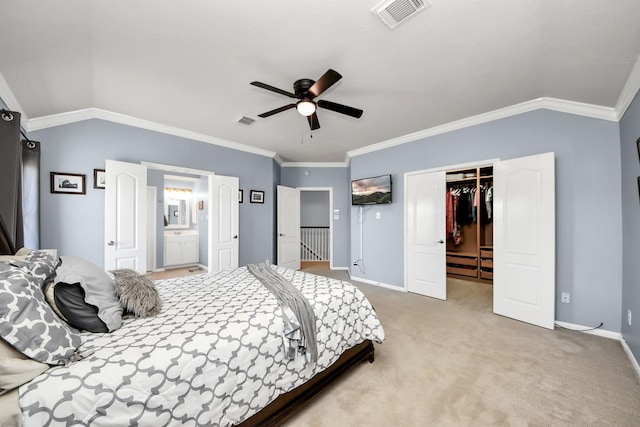 carpeted bedroom with vaulted ceiling, baseboards, visible vents, and crown molding