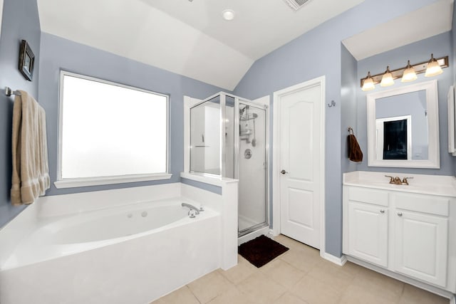 full bathroom with lofted ceiling, a stall shower, vanity, a bath, and tile patterned floors