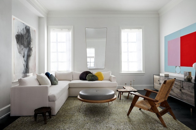 living area with a healthy amount of sunlight, crown molding, and wood finished floors