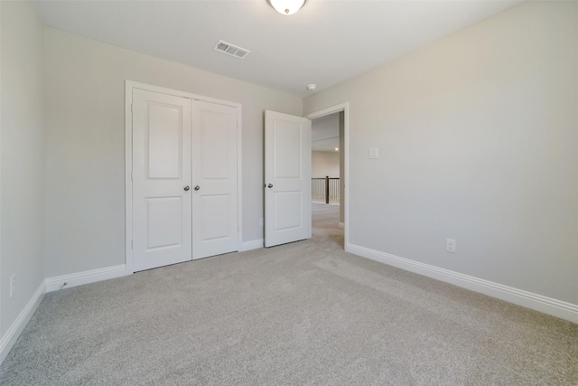 16319 Placid Stream St, Conroe, TX 77302 - unfurnished bedroom with light carpet, a closet, and baseboards