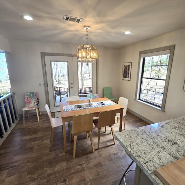 dining area with an inviting chandelier, recessed lighting, dark wood-style flooring, and visible vents