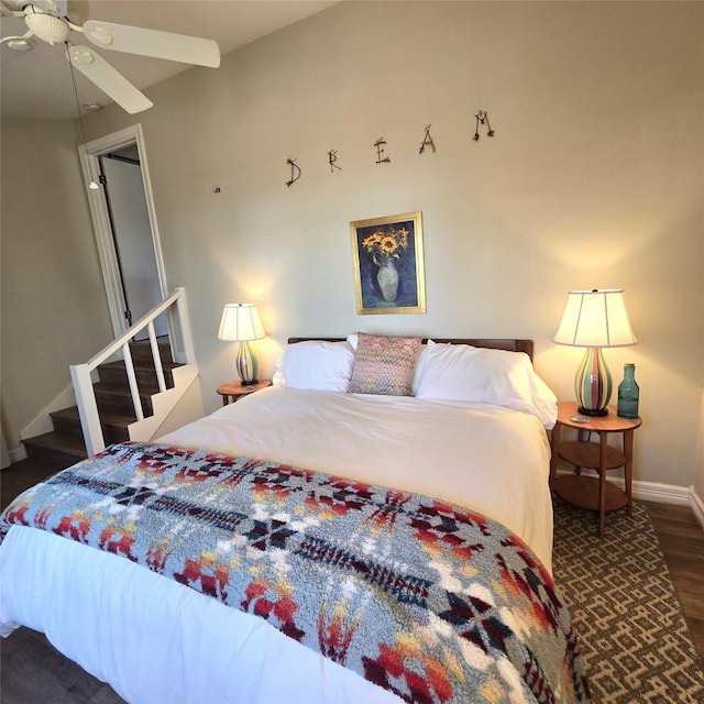 bedroom featuring baseboards, a ceiling fan, and wood finished floors