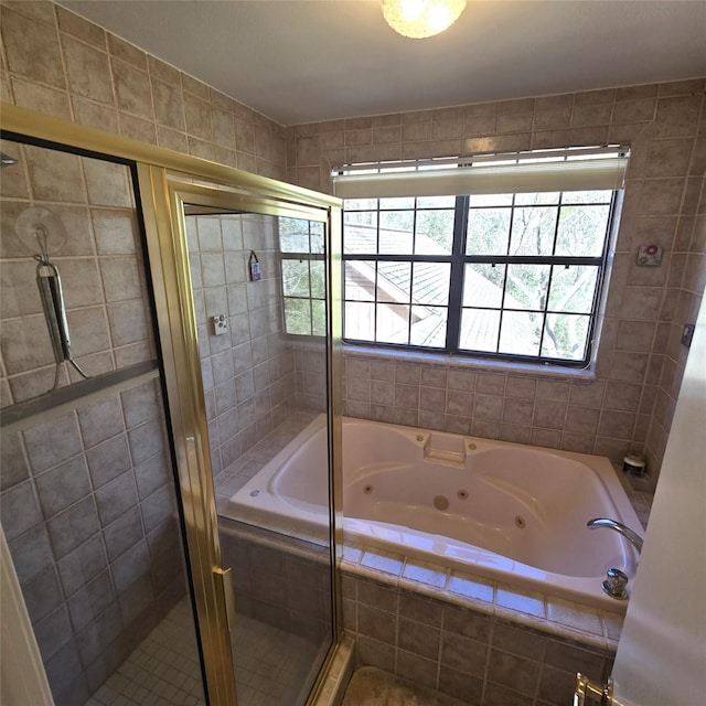 bathroom with a whirlpool tub and a shower stall