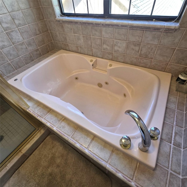 full bathroom featuring a whirlpool tub