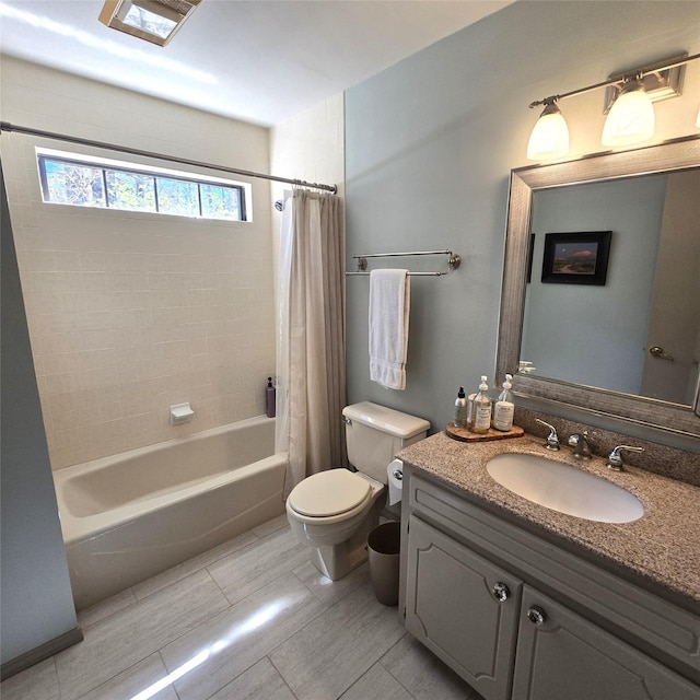 bathroom featuring vanity, shower / tub combo with curtain, and toilet