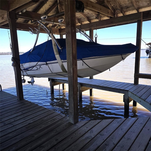 view of dock featuring a water view and boat lift