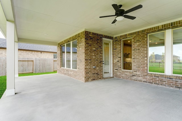 view of patio / terrace with a ceiling fan and fence