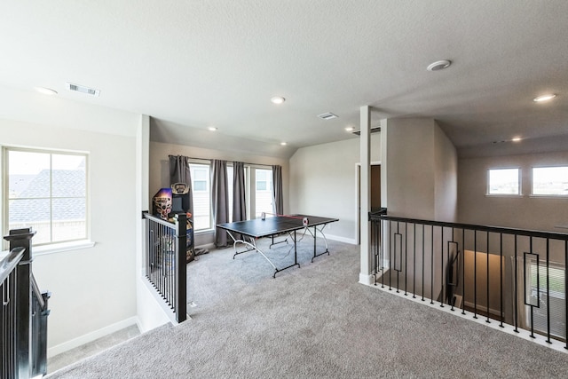 rec room with visible vents, baseboards, lofted ceiling, carpet, and recessed lighting