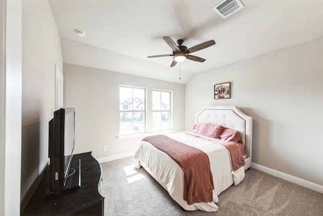 bedroom featuring lofted ceiling, carpet flooring, visible vents, and baseboards