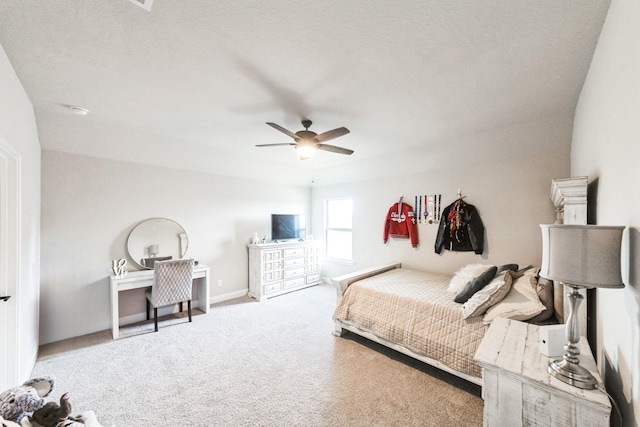 bedroom featuring carpet, baseboards, and ceiling fan