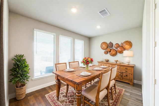 dining area with recessed lighting, light wood-type flooring, visible vents, and baseboards