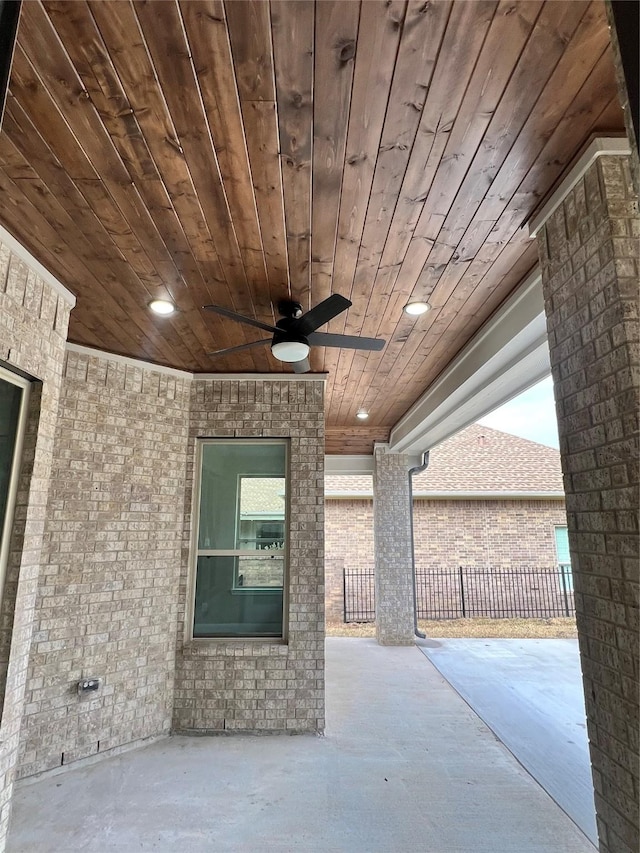 view of patio / terrace featuring fence and a ceiling fan