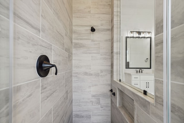 full bathroom featuring a shower stall and vanity