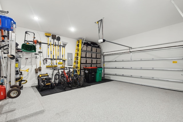 garage with recessed lighting and electric panel