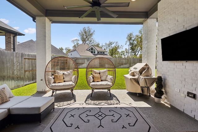 view of patio / terrace featuring a fenced backyard, a ceiling fan, and a grill