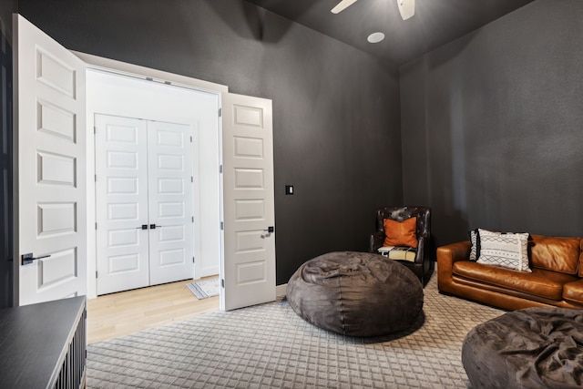 sitting room featuring ceiling fan