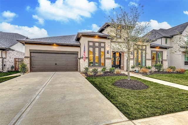 view of front of property with a garage, concrete driveway, stone siding, stucco siding, and a front lawn